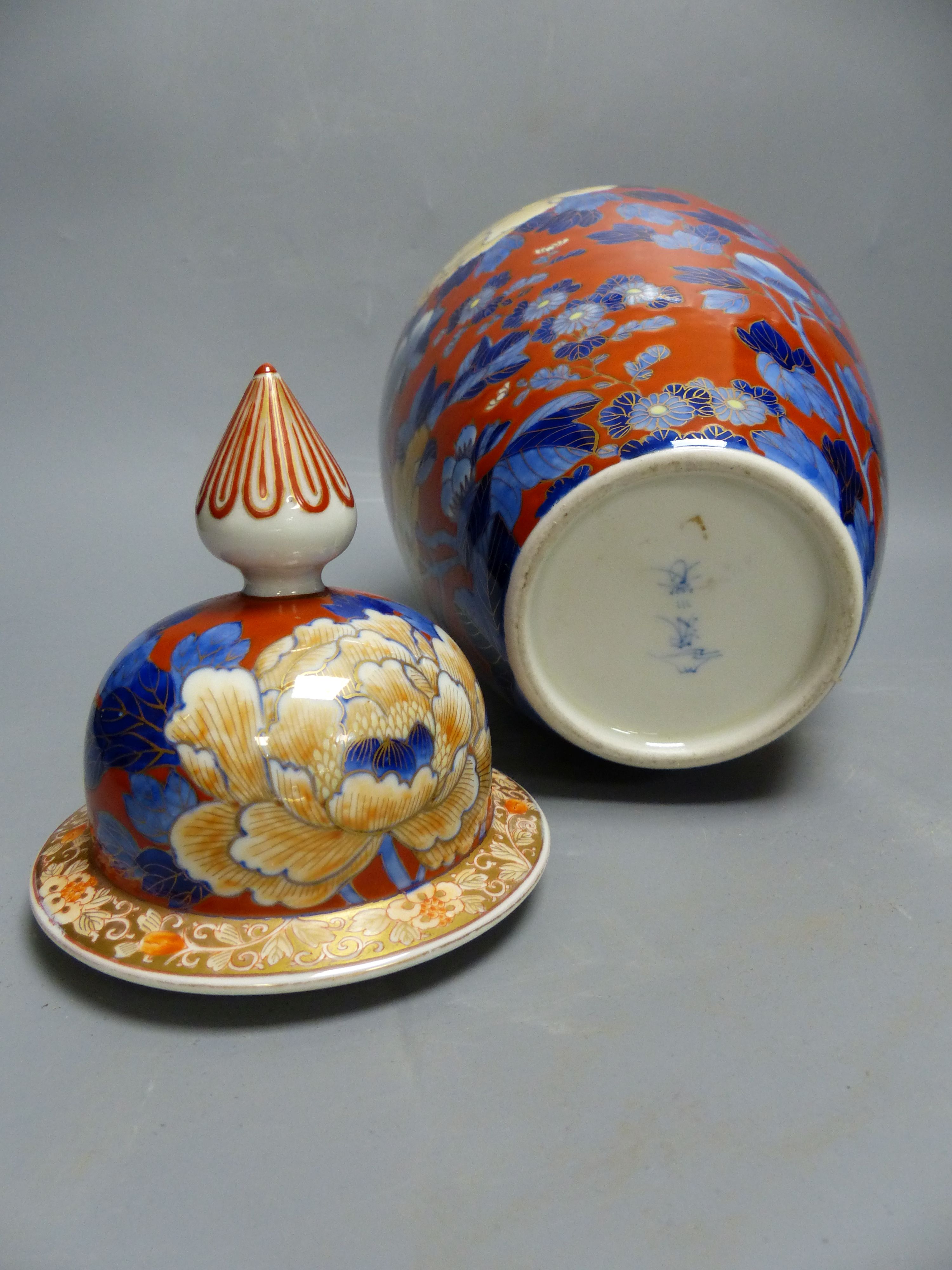 A Japanese Imari vase and cover, by Fukugawa, early 20th century and a similar pair of jars and covers, Meiji period, tallest 36cm